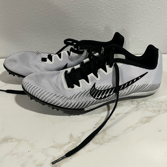 blue and white nike track spikes